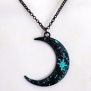 Blue and black sparkling large crescent moon with iridescent blue stars